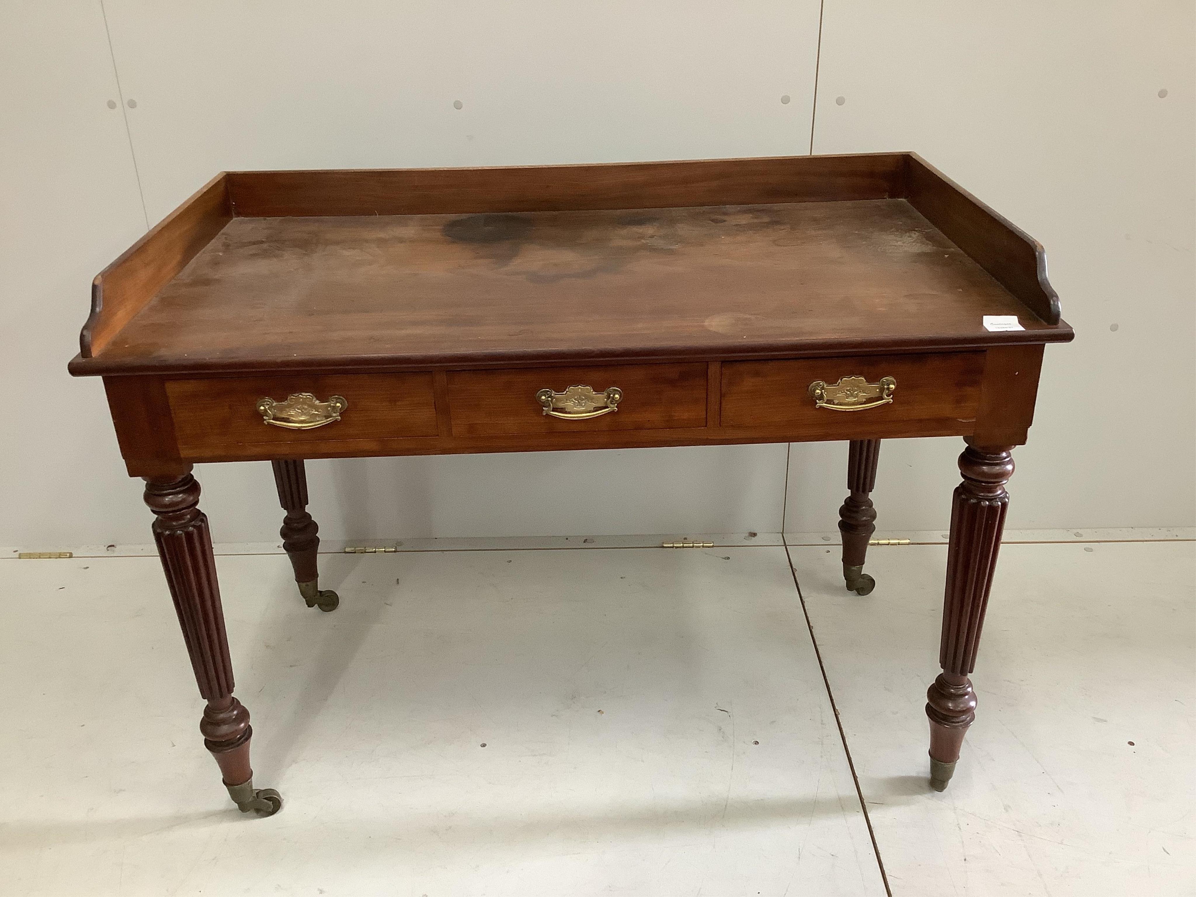 A Victorian mahogany washstand (loose top), width 115cm, depth 63cm, height 84cm. Condition - fair